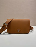 Prada leather crossbody bag with flap and adjustable strap, brown pebbled finish