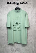 Mint green graphic T-shirt with crew neck and short sleeves, front abstract logo print.