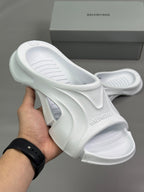 Balenciaga white slide sandals with cushioned footbed and sculpted sole