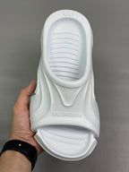 Balenciaga white slide sandals, back view with embossed logo on footbed