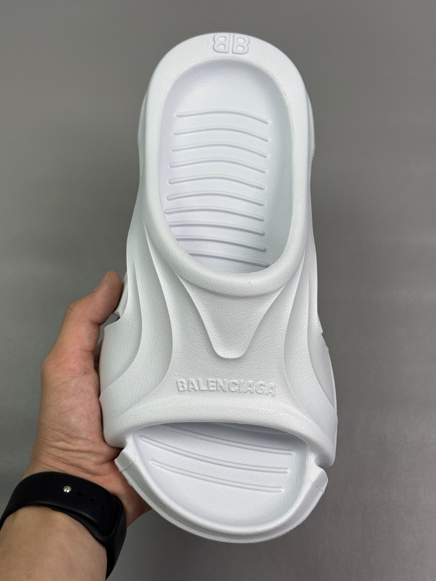 Balenciaga white slide sandals, back view with embossed logo on footbed