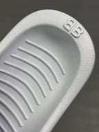 Balenciaga white rubber sandal sole with tread pattern and logo detail