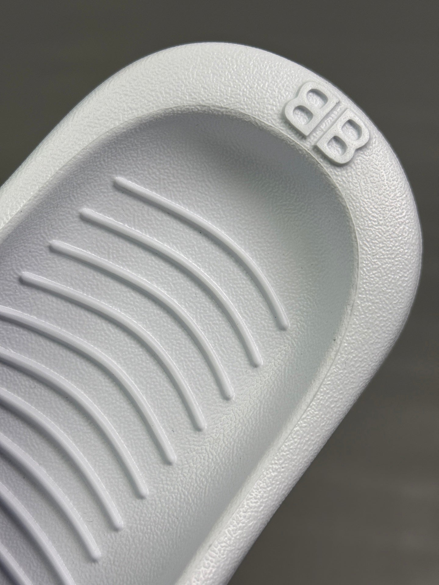 Balenciaga white rubber sandal sole with tread pattern and logo detail