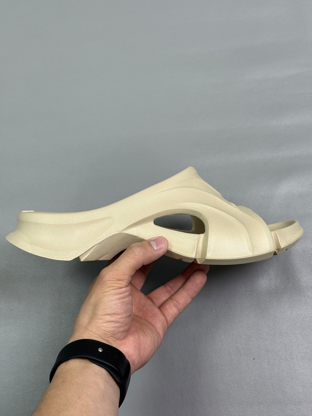 Cream Balenciaga slide sandals with side cutout strap and thick platform sole