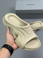 Cream slide sandals with molded footbed and chunky contoured sole, Balenciaga branding