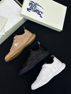 Burberry shoes with tan, black, and white sneakers with lace-up design