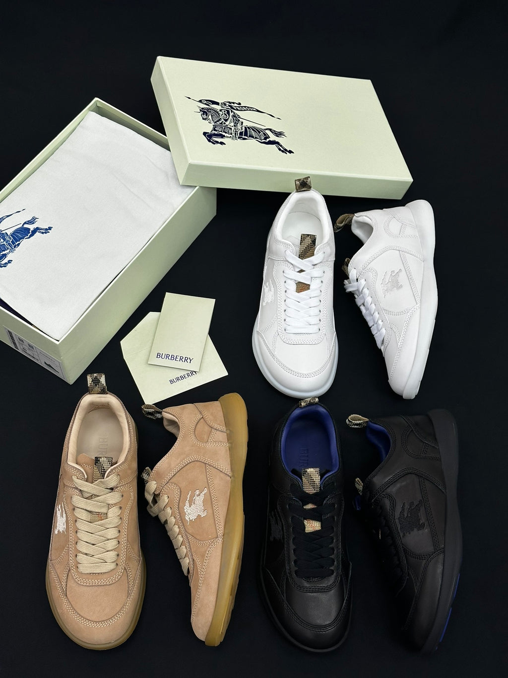 Burberry shoes with white, tan, blue, and black sneakers with lace-up fronts