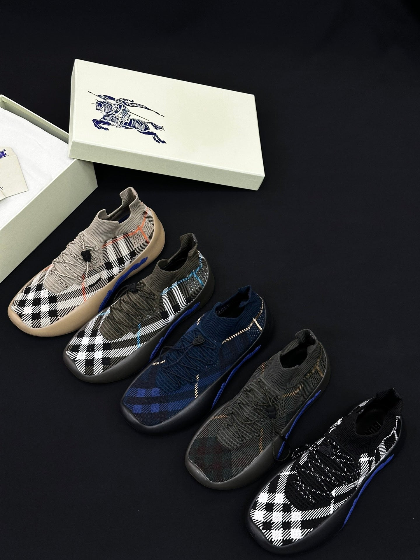 Burberry knit slip-on sneakers, black checkers and blue stripe accents