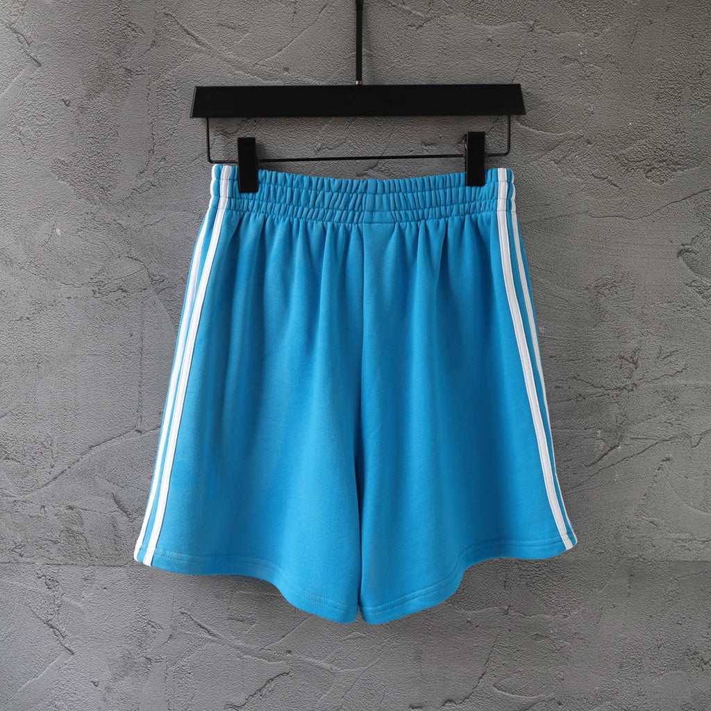 Balenciaga blue shorts with white side stripes and elastic waistband