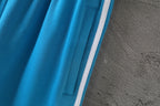 Balenciaga blue shorts with side panel stripe and stitched pocket opening