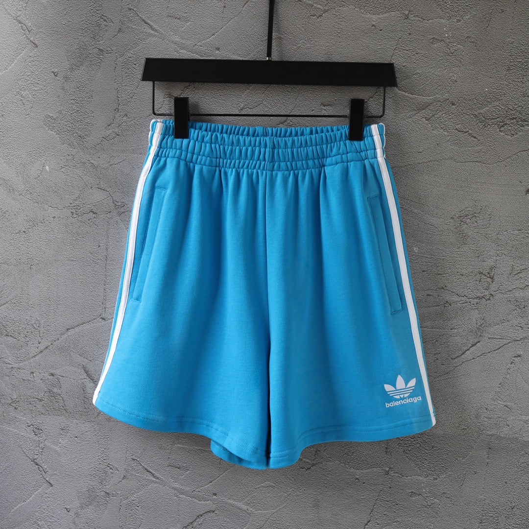 Balenciaga blue shorts with white side stripes, elastic waistband and side pockets