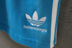 Balenciaga blue shorts with white trefoil logo and side stripe trim