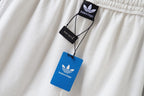 White shorts with hanging Balenciaga tags near the elastic waistband