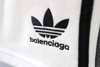 Close-up of Balenciaga logo on white shorts