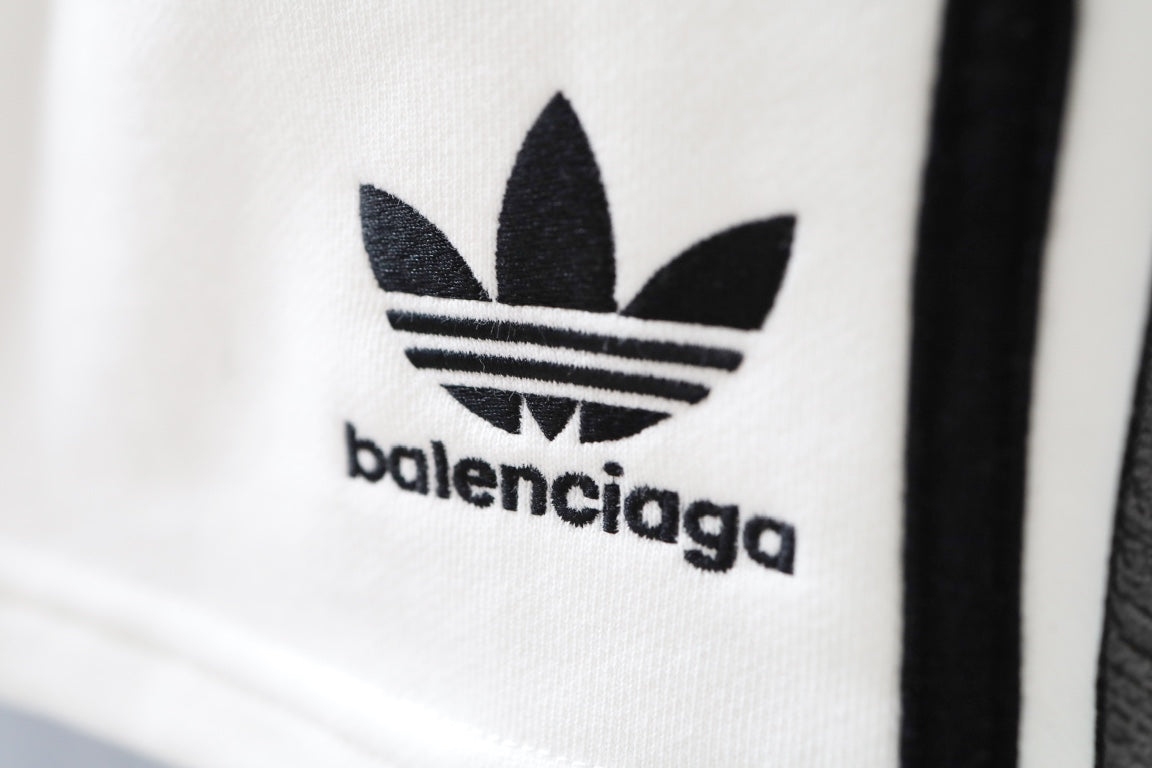 Close-up of Balenciaga logo on white shorts