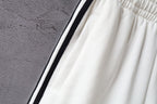 Balenciaga white shorts with black side stripe and gathered waist
