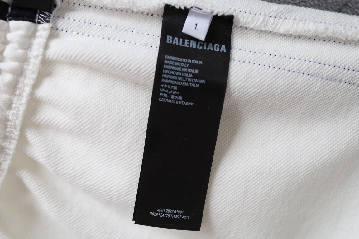 White shorts with brand label tag at the waistband