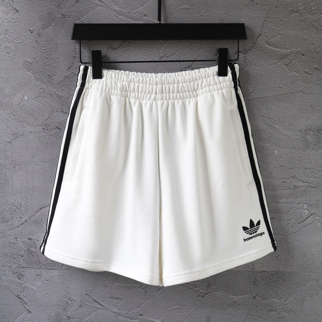 White Balenciaga shorts with elastic waistband and black side stripes