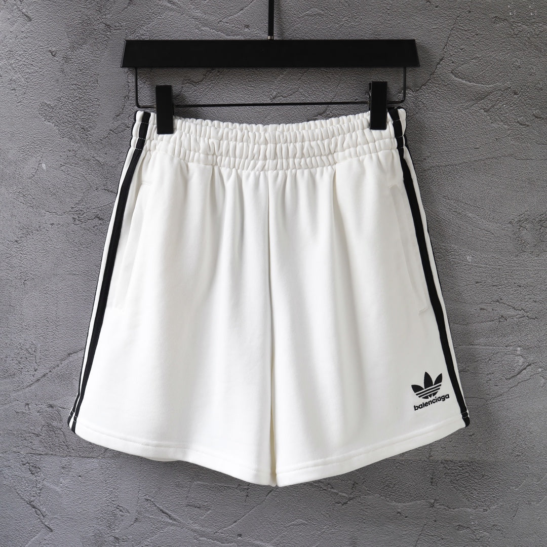 White Balenciaga shorts with elastic waistband and black side stripes