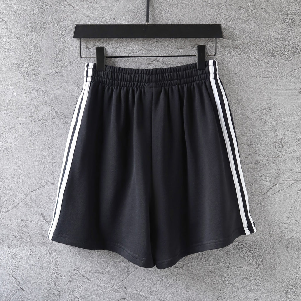 Balenciaga black shorts with elastic waistband and white triple side stripes