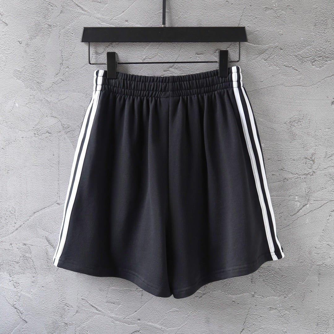 Balenciaga black shorts with elastic waistband and white triple side stripes