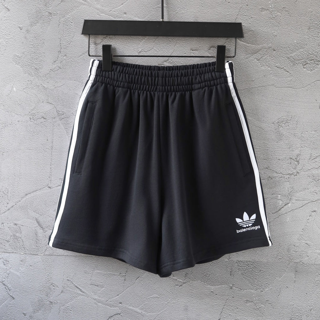 Balenciaga black shorts with white side stripes and small front logo