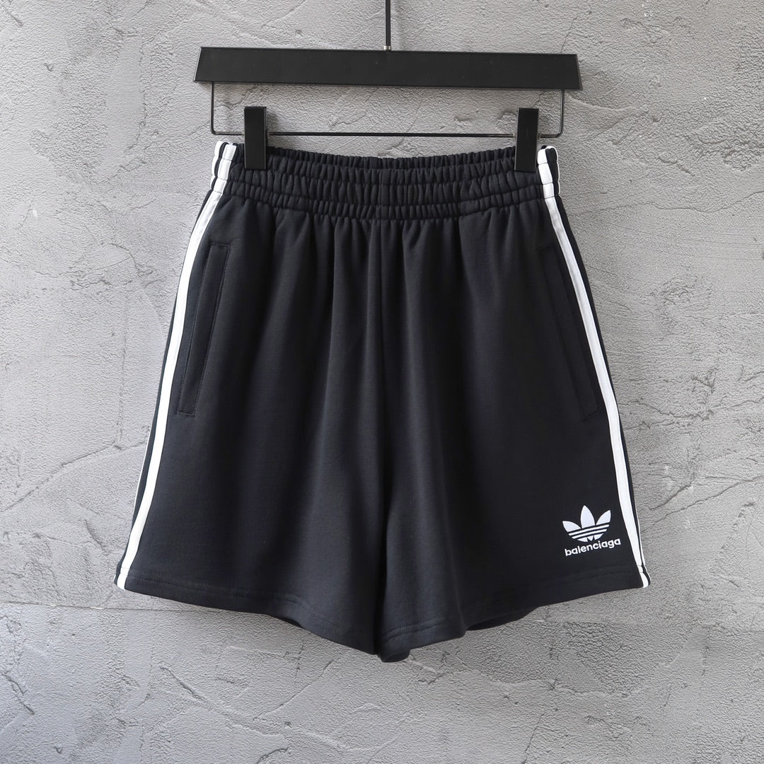 Balenciaga black shorts with white side stripes and small front logo