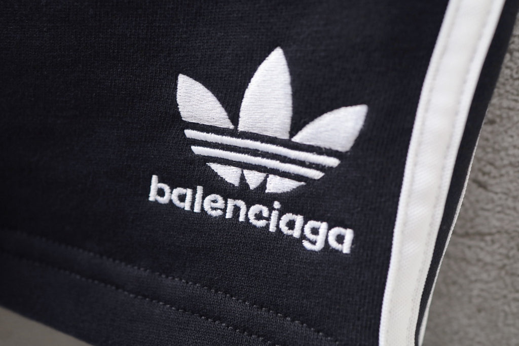 Balenciaga logo print on black shorts with white side stripe