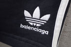 Balenciaga logo print on black shorts with white side stripe