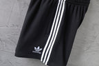 Balenciaga shorts with white triple stripe panel and balenciaga logo near hem