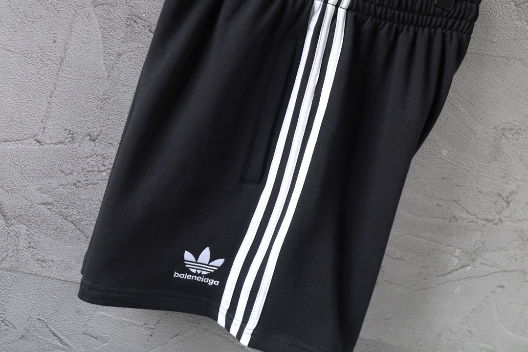 Balenciaga shorts with white triple stripe panel and balenciaga logo near hem
