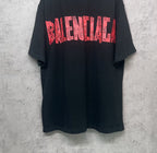 Black Balenciaga T-shirt back view with red graphic logo print, short sleeves.