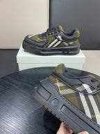 Burberry sneakers on shoe box, black uppers with yellow plaid and white stripe