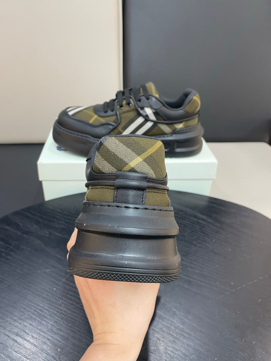 Burberry sneakers rear view, black leather with yellow plaid panels and thick sole