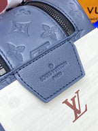 Louis Vuitton bag pocket panel with embossed monogram motifs and leather corner tab