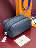 Louis Vuitton bag in dark blue embossed monogram with top zip and curved handle loops