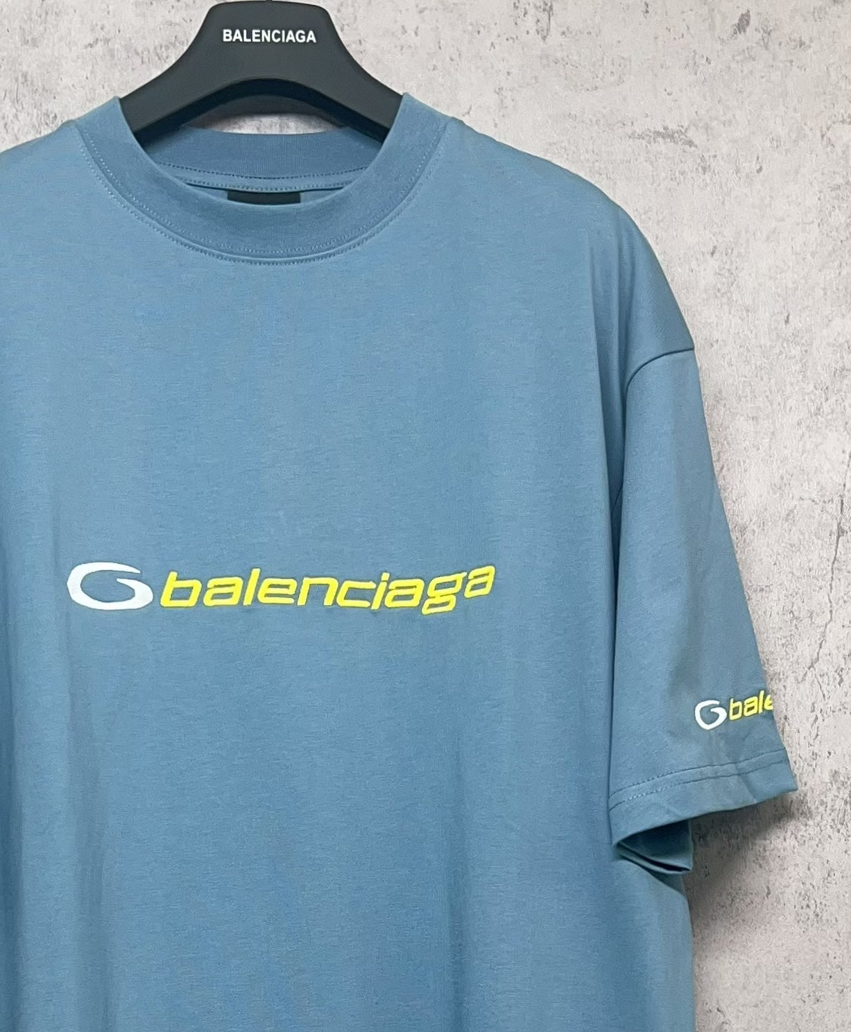 Blue Balenciaga logo T-shirt, front angled view with short sleeves
