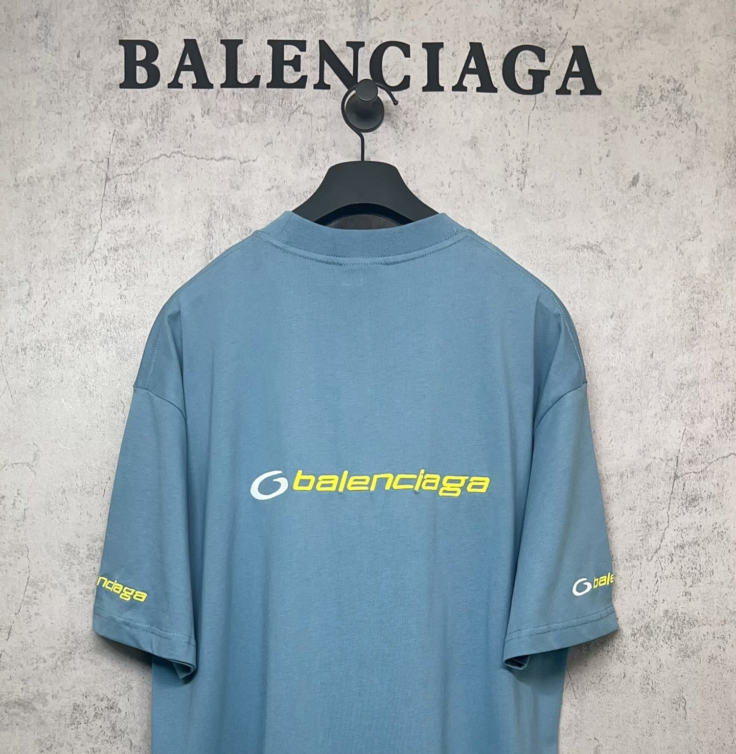 Blue Balenciaga logo T-shirt, back view with short sleeves and crew neck