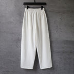 White wide-leg pants with elastic waistband, relaxed fit, back view