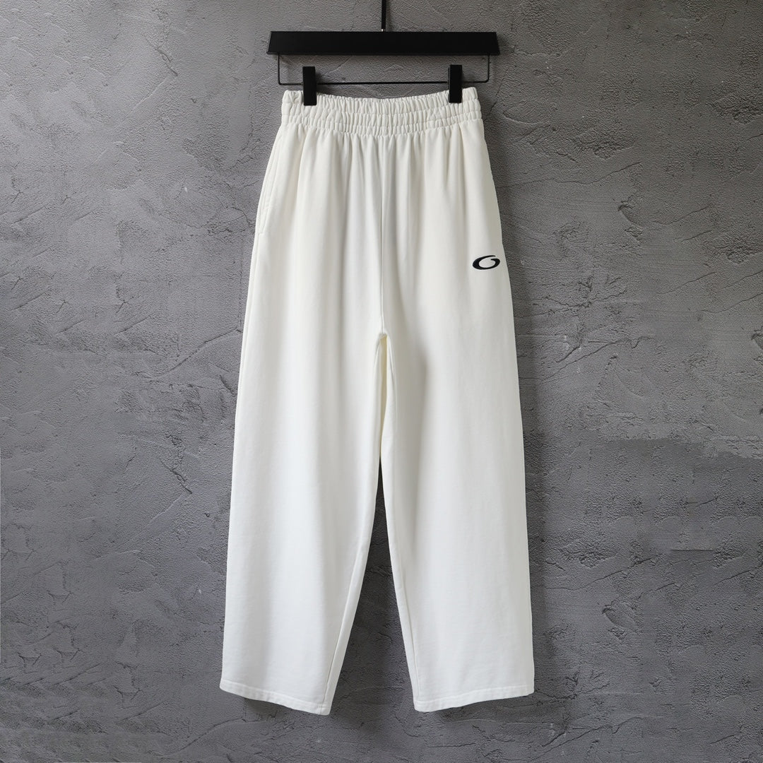 White wide-leg pants with elastic waistband and drawstring, front view