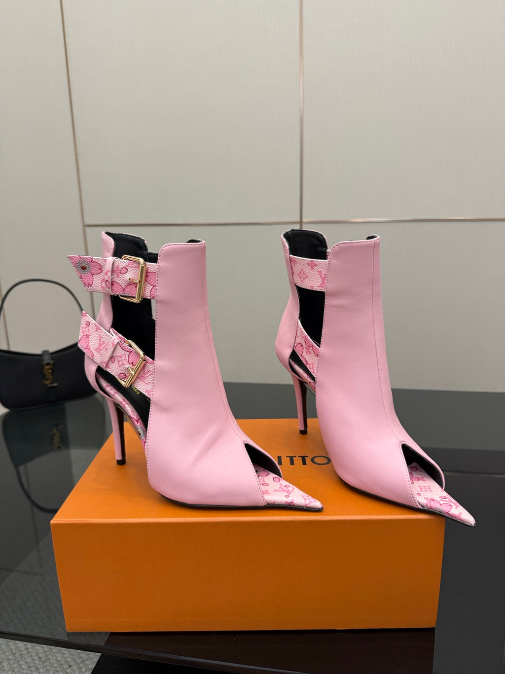 Women's Louis Vuitton pink ankle boots with patterned panels and gold buckles