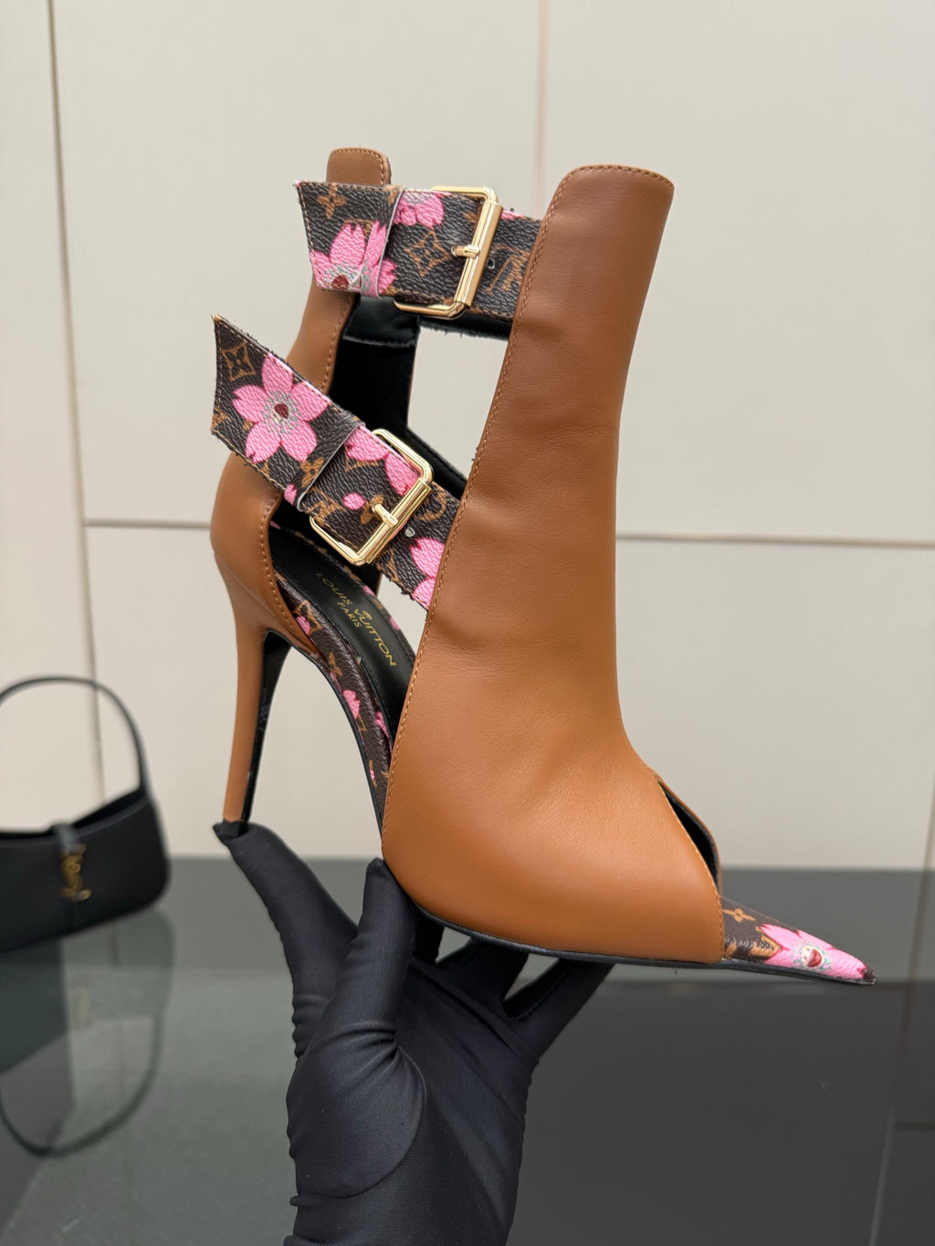 Women's Louis Vuitton ankle boots, tan leather with black monogram floral band and stiletto heel.