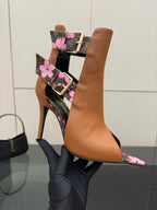 Women's Louis Vuitton ankle boots, tan leather with black monogram floral band and stiletto heel.