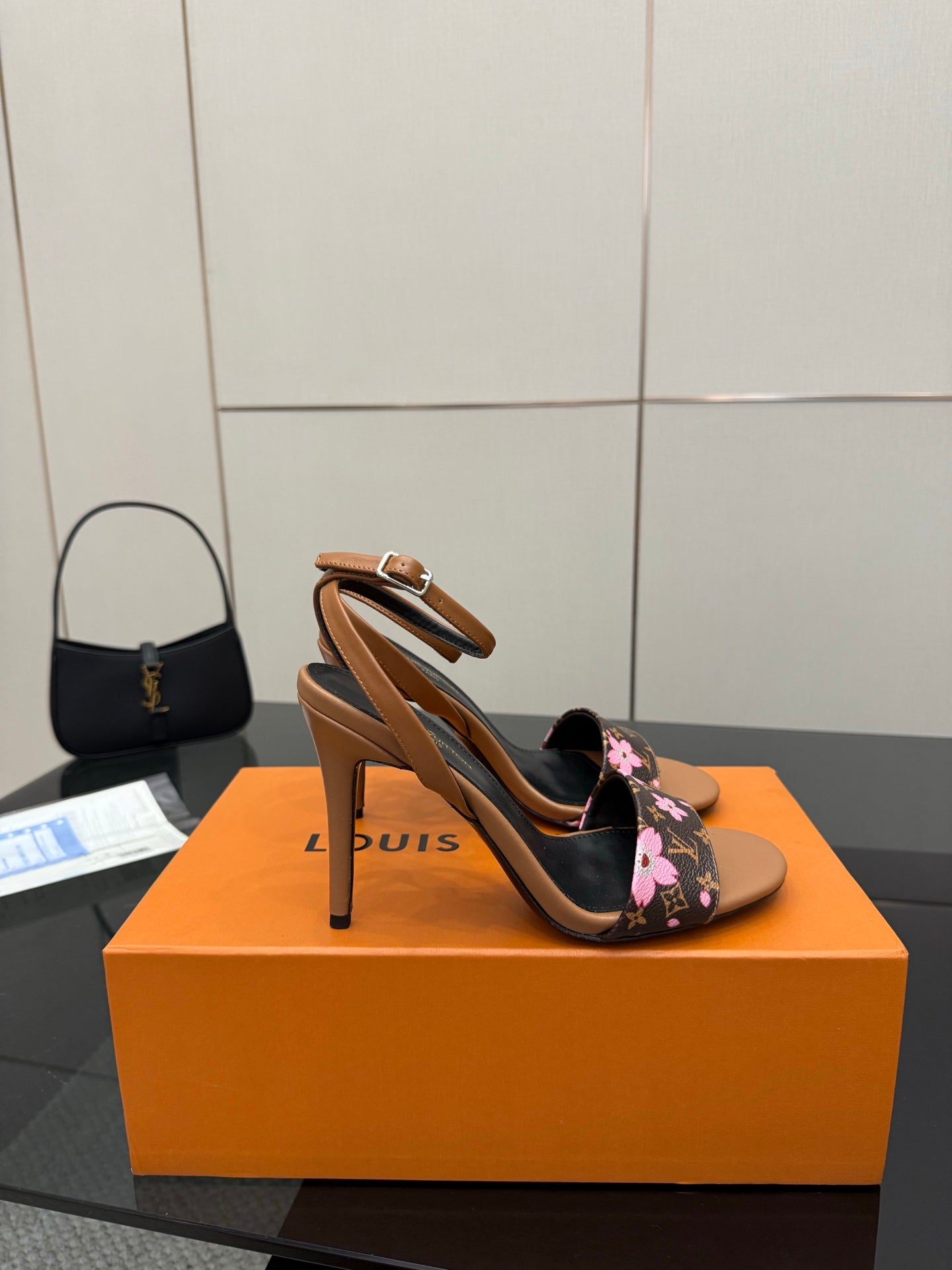 Louis Vuitton slingback sandal with black floral monogram straps and tan block heel