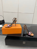 Louis Vuitton slingback sandal with black floral monogram strap and tan block heel