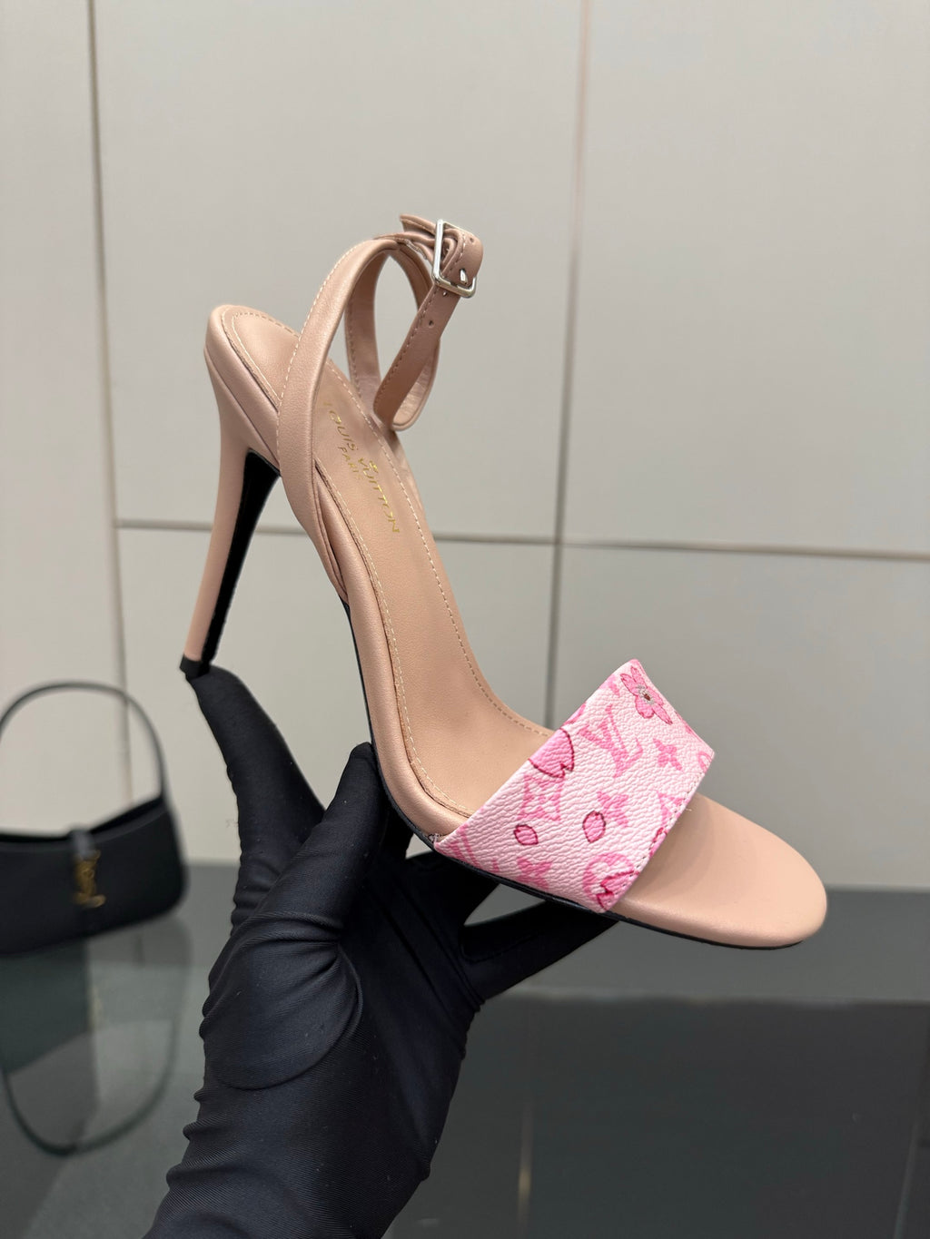 Nude heeled sandals with pink patterned forefoot band and high stiletto heel