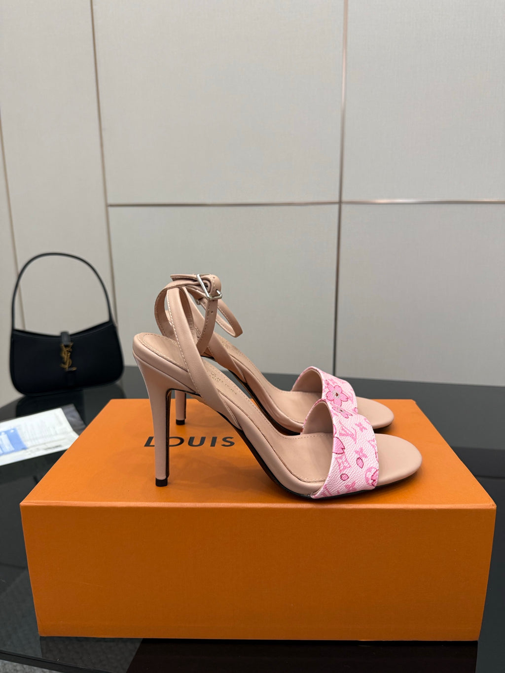 Nude heeled sandals with pink patterned ankle strap and high stiletto heel