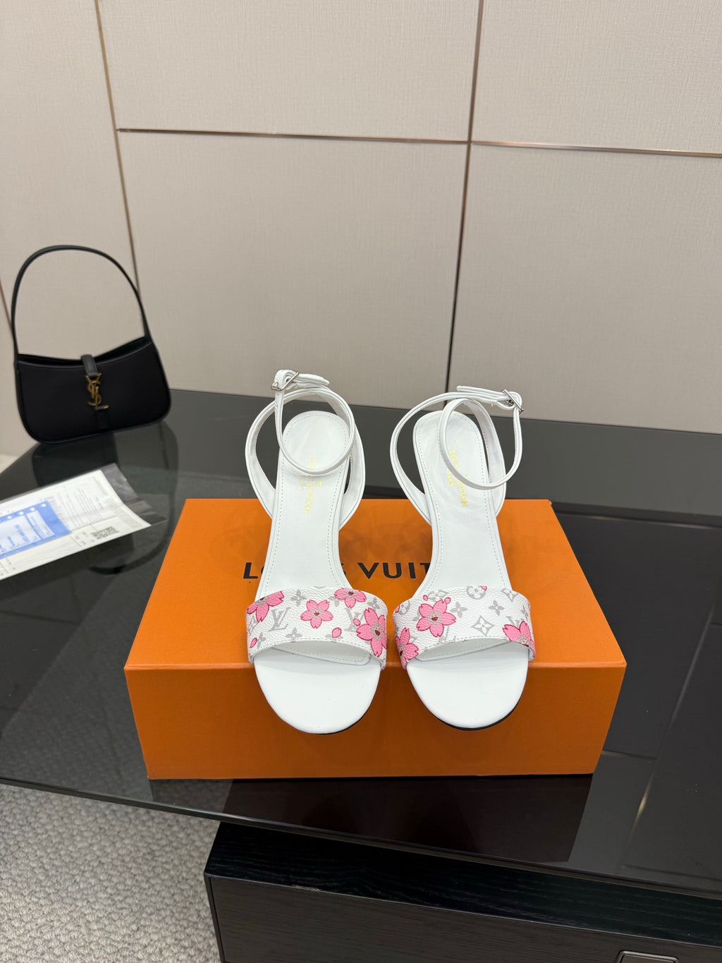 Women's heeled sandals in white with pink floral straps, stiletto heel and ankle ties