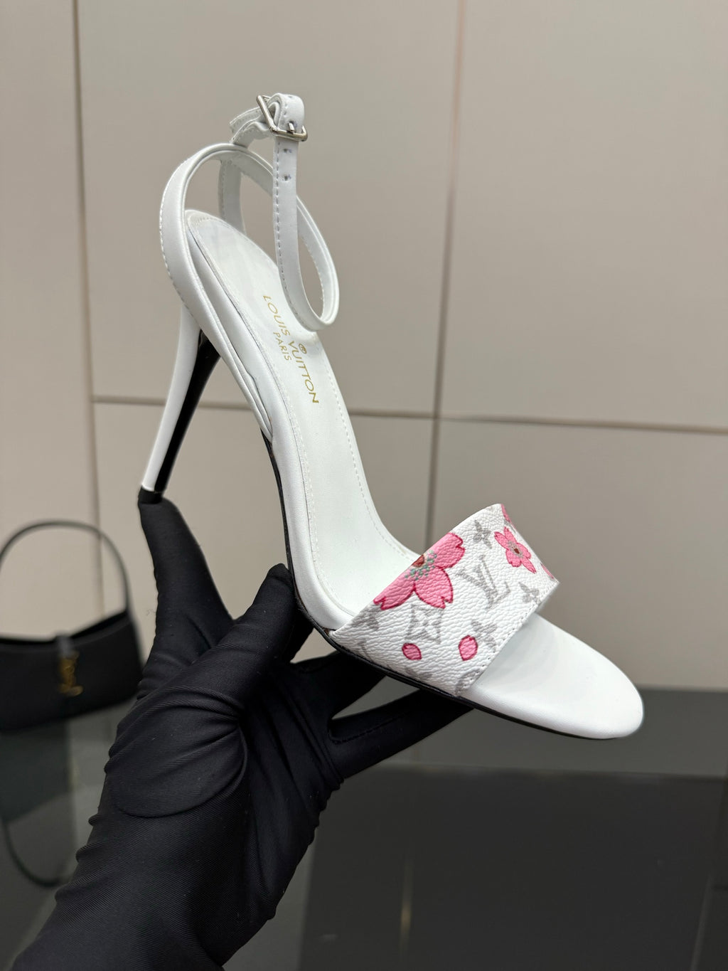 Women's white slingback heeled sandal with pink floral wrap and thin stiletto heel
