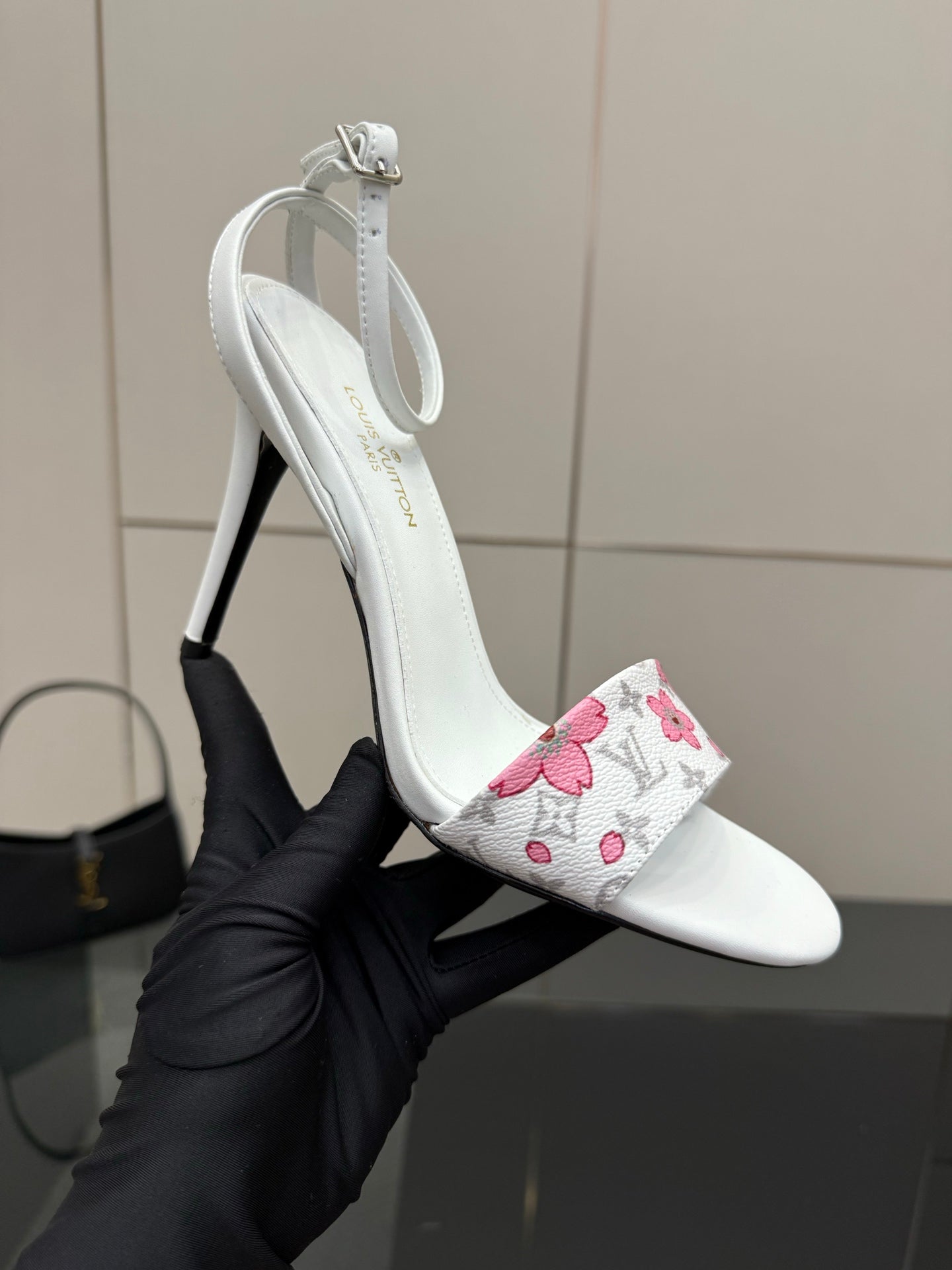 Women's white slingback heeled sandal with pink floral wrap and thin stiletto heel